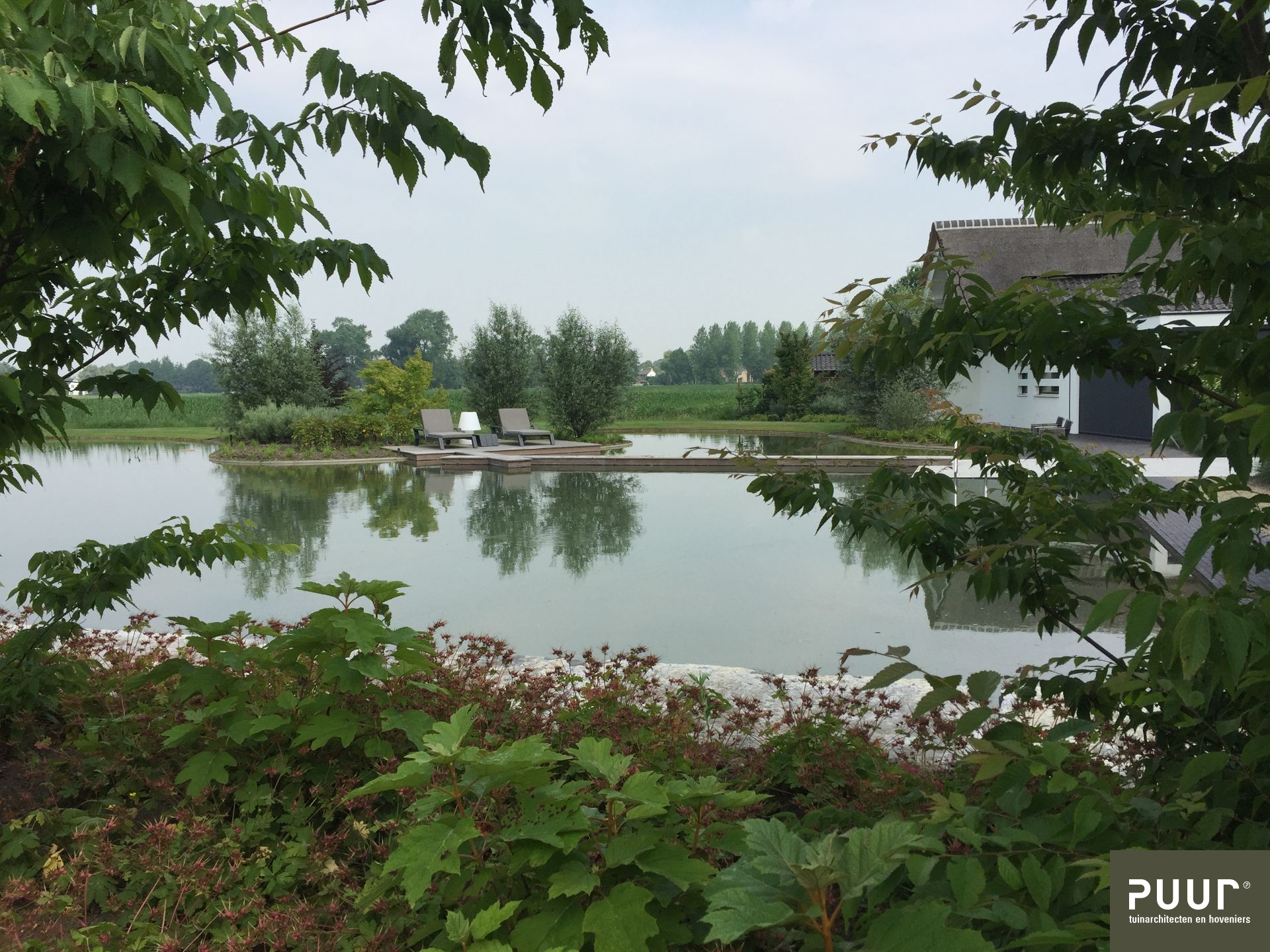 Natuurvijver met kadeblokken - Puur Groen